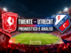 Twente Utrecht pronostico 18 ottobre 2026: stemmi FC Twente e FC Utrecht sullo stadio e scritta Pronostico e analisi